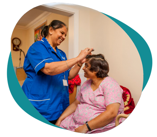 A carer giving personal care to a patient